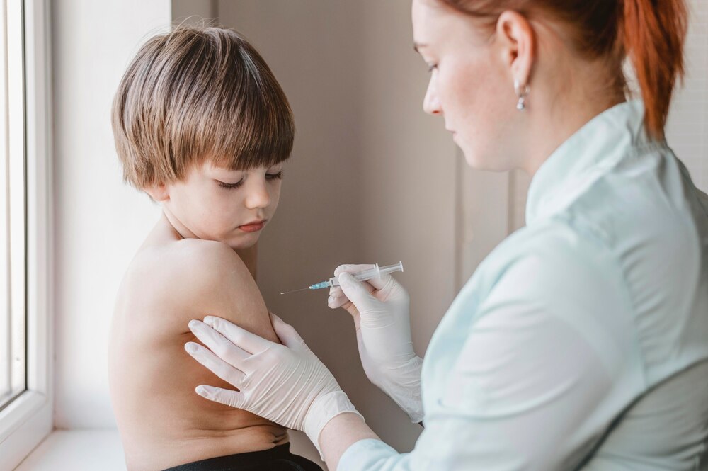 Doctor with child getting a vaccine