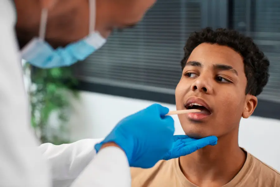 Doctor taking care of afro-american child